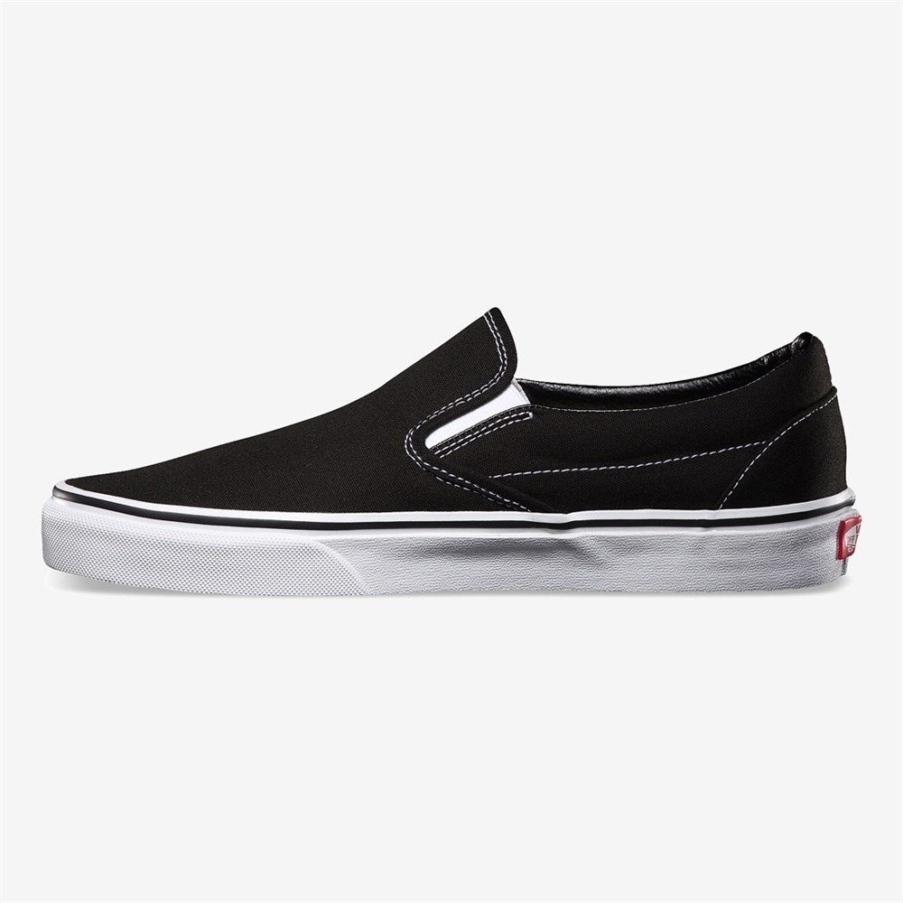 vans black on black slip on